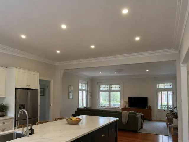 Living and kitchen interior with recessed ceiling downlights, white ceilings and cabinetry in Newcastle West
